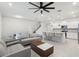 Open concept living and kitchen area with modern furniture at 297 Jetty Way, Davenport, FL 33897