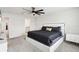 Main bedroom with king bed and access to the en-suite bathroom at 297 Jetty Way, Davenport, FL 33897