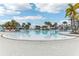 Large resort-style pool with plenty of lounge chairs at 297 Jetty Way, Davenport, FL 33897