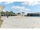 Beach volleyball court with a net and surrounding fencing at 297 Jetty Way, Davenport, FL 33897