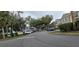Gated community entrance with well-maintained landscaping and parking at 4145 Plantation Cove Dr, Orlando, FL 32810