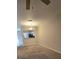 Dining area with neutral walls, carpet flooring, and a pass-through to kitchen at 4145 Plantation Cove Dr, Orlando, FL 32810