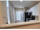 Kitchen with stainless steel appliances and white cabinets at 4145 Plantation Cove Dr, Orlando, FL 32810