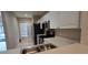 Kitchen with stainless steel appliances and white cabinets at 4145 Plantation Cove Dr, Orlando, FL 32810