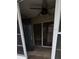 Screened porch with ceiling fan and access door at 4145 Plantation Cove Dr, Orlando, FL 32810