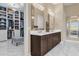 Double vanity bathroom with a large walk-in closet at 5599 Sw 92Nd Avenue Rd, Ocala, FL 34481