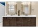 Double vanity bathroom with plenty of storage and elegant lighting at 5599 Sw 92Nd Avenue Rd, Ocala, FL 34481