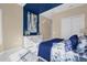 Bright bedroom featuring a white dresser and blue bedding at 5599 Sw 92Nd Avenue Rd, Ocala, FL 34481