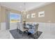 Elegant dining room with chandelier and large windows at 5599 Sw 92Nd Avenue Rd, Ocala, FL 34481