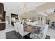Open concept dining room with seating for six and views to the kitchen at 5599 Sw 92Nd Avenue Rd, Ocala, FL 34481