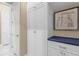 Hallway with storage cabinets and a neutral color scheme at 5599 Sw 92Nd Avenue Rd, Ocala, FL 34481