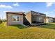 House exterior with a screened patio and manicured lawn at 5599 Sw 92Nd Avenue Rd, Ocala, FL 34481