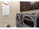 Laundry room with washer, dryer, and extra storage at 5599 Sw 92Nd Avenue Rd, Ocala, FL 34481