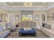 Bright living room featuring comfy seating and a large TV at 5599 Sw 92Nd Avenue Rd, Ocala, FL 34481