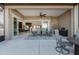 Large covered patio with view into the kitchen and dining area at 5599 Sw 92Nd Avenue Rd, Ocala, FL 34481