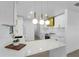 Modern kitchen with white cabinets and a large island at 607 Dunblane Dr, Winter Park, FL 32792