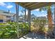 Screened patio with lush landscaping and community view at 6118 Westgate Dr # 101, Orlando, FL 32835