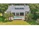 Aerial view of the backyard, featuring a pool, covered patio, and well-manicured lawn at 6241 Blakeford Dr, Windermere, FL 34786