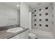 Well-lit bathroom features updated fixtures, tub-shower combination, and vanity at 6241 Blakeford Dr, Windermere, FL 34786