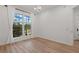 Bright bedroom with wood floor, chandelier, and large window at 6241 Blakeford Dr, Windermere, FL 34786