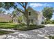 Charming two-story home featuring manicured landscaping and a welcoming entrance at 6241 Blakeford Dr, Windermere, FL 34786