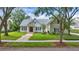 Charming two-story home with a landscaped lawn and inviting entrance at 6241 Blakeford Dr, Windermere, FL 34786