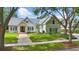 Beautiful suburban home with landscaped front yard and brick walkway at 6241 Blakeford Dr, Windermere, FL 34786