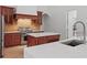 Stylish kitchen featuring custom cabinets, stainless steel appliances, an island, and granite countertops at 6241 Blakeford Dr, Windermere, FL 34786