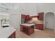 Well-equipped kitchen featuring custom cabinets, a center island, and modern appliances at 6241 Blakeford Dr, Windermere, FL 34786