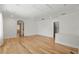 Large living room with hardwood floors, an arched doorway, and views to the backyard at 6241 Blakeford Dr, Windermere, FL 34786