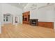 Spacious living room with wood floors, fireplace, and custom built-ins at 6241 Blakeford Dr, Windermere, FL 34786