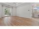 Serene main bedroom featuring tray ceilings, wood floors, and access to a private balcony at 6241 Blakeford Dr, Windermere, FL 34786