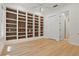 Bright and spacious office featuring custom built-in bookshelves and light-colored floors at 6241 Blakeford Dr, Windermere, FL 34786
