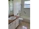 Bathroom featuring a tiled tub/shower combo and light fixtures at 63 York Ct, Kissimmee, FL 34758