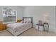 Bedroom with a panel wall, tile flooring, and double blinds at 63 York Ct, Kissimmee, FL 34758