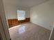 A sunlit bedroom featuring neutral paint, tile flooring, and wood paneling for an inviting space at 63 York Ct, Kissimmee, FL 34758
