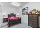 Bedroom with dark wood furniture and red bedding at 63 York Ct, Kissimmee, FL 34758