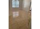 Bright living room with neutral tile floors and window offering a view of the outside at 63 York Ct, Kissimmee, FL 34758