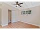 Spacious bedroom with hardwood floors and ample closet space at 6618 Hill Top Rd, Orlando, FL 32810