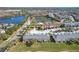 Aerial view of townhouses by a lake at 812 Park Grove Ct, Orlando, FL 32828