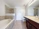 Bathroom with double vanity, garden tub, and shower at 812 Park Grove Ct, Orlando, FL 32828