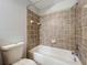 Clean bathroom with tile surround and a shower/tub combo at 812 Park Grove Ct, Orlando, FL 32828