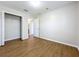Bedroom with wood-look floors and a large closet at 812 Park Grove Ct, Orlando, FL 32828