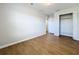 Spacious bedroom with wood-look floors and a closet at 812 Park Grove Ct, Orlando, FL 32828