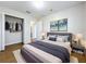 Bright bedroom with double bed, walk-in closet, and ensuite bathroom at 812 Park Grove Ct, Orlando, FL 32828
