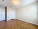 Bright bedroom with wood-look floors and double door closet at 812 Park Grove Ct, Orlando, FL 32828