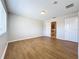 Spacious bedroom with wood flooring and access to a bathroom at 812 Park Grove Ct, Orlando, FL 32828
