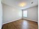 Bright bedroom with wood-look floors and a window at 812 Park Grove Ct, Orlando, FL 32828