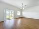 Dining room with hardwood floors, chandelier, and lake view at 812 Park Grove Ct, Orlando, FL 32828