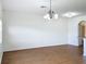 Bright dining room with hardwood floors and a chandelier at 812 Park Grove Ct, Orlando, FL 32828